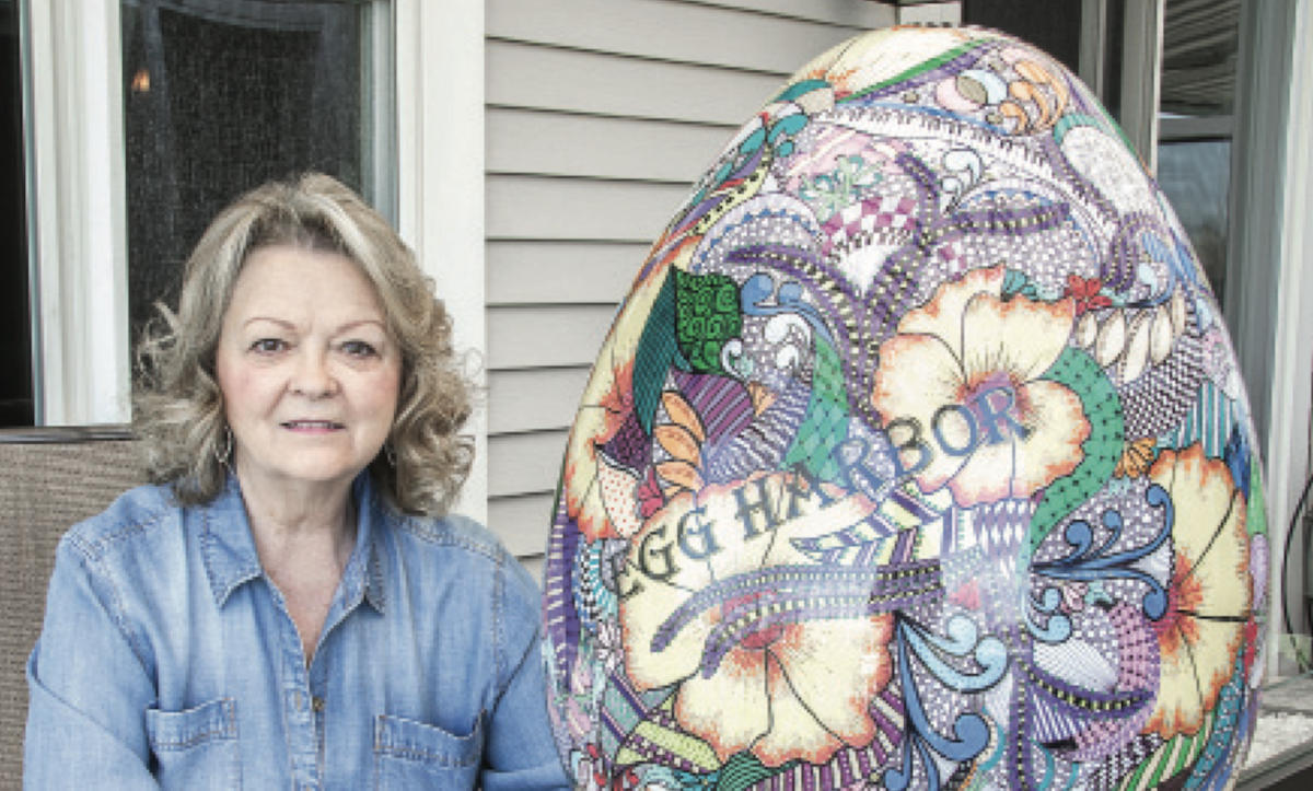 Sun City resident and artist Sue Lee spent 110 hours creating and painting an egg headed for Egg Harbor’s popular celebration EGGstravaganza in Door County, WI. (Photo by Tony Pratt/Sun Day)