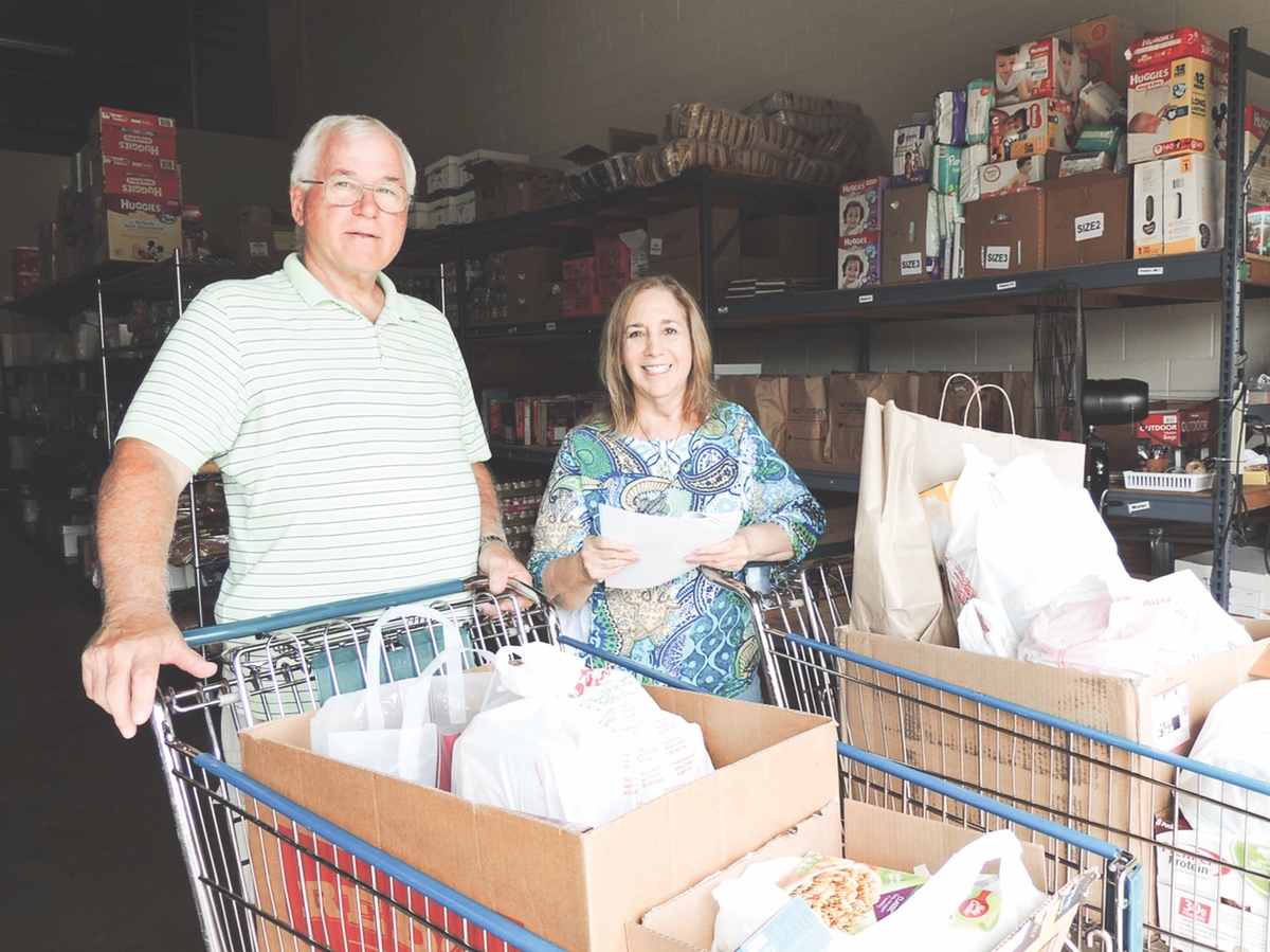 Frank Fenneman, N-28 organizer, with Harriett Ford, Food Pantry Secretary/Community Outreach. (Photo provided)