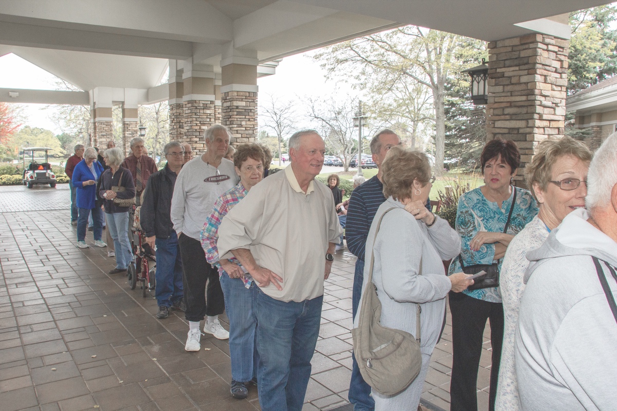 Lines of residents eagerly await entrance to the anniversary festivities.