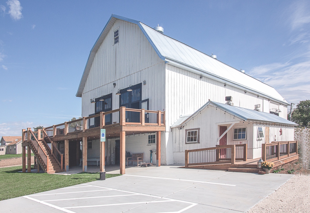 Remembering her own dream to be married in a barn, Barb Lincoln and her husband Chris bought and renovated this old dairy farm, once owned by John Conley, into a modern event center with historic appeal. (Photo by Tony Pratt/Sun Day)