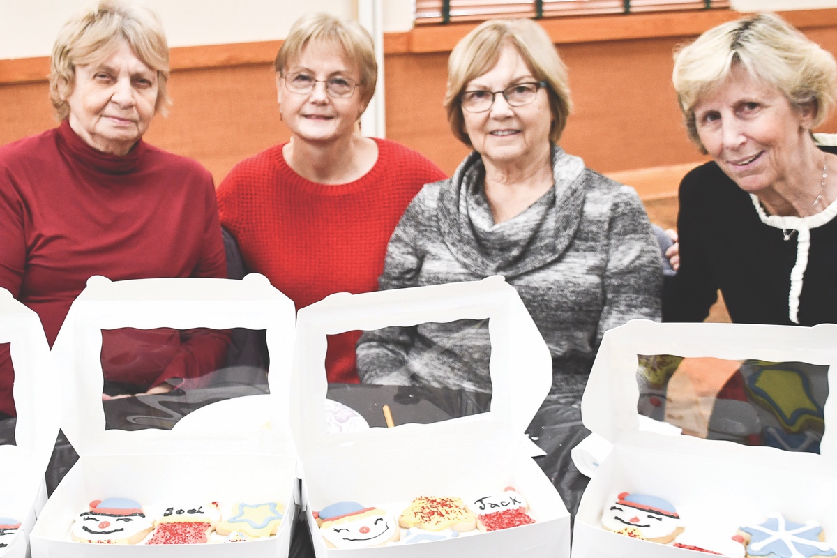 N. Jean Hannigan, L. Bambas, J. Schneider, and R. Schank (L to R) display their creative cookie decorating.