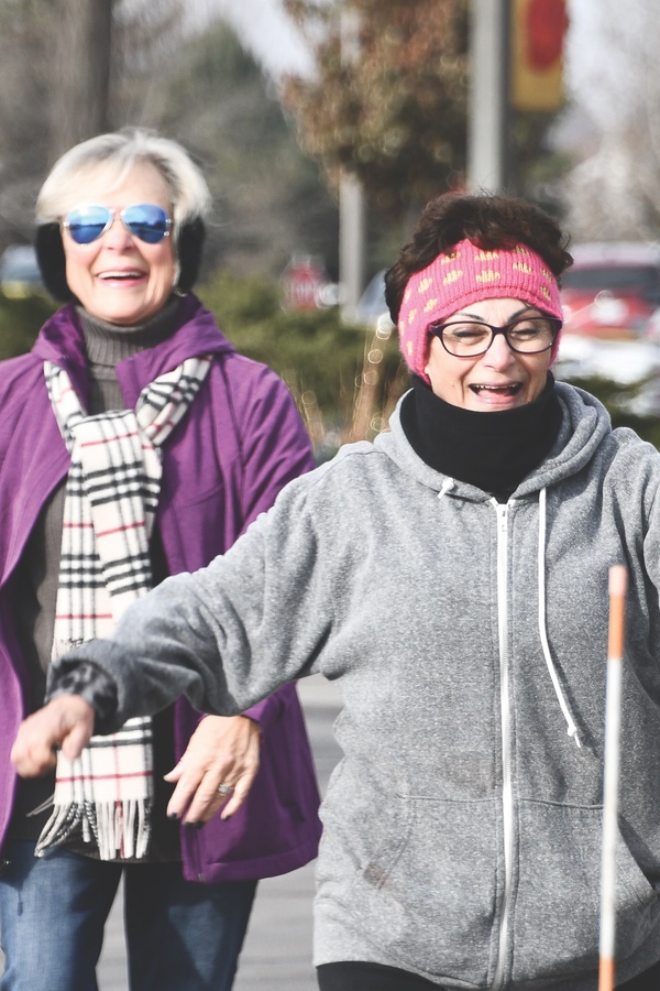 First to cross the finish line are Barb Campell and Debi Campbell. (Photos by Christine Such/Sun Day)