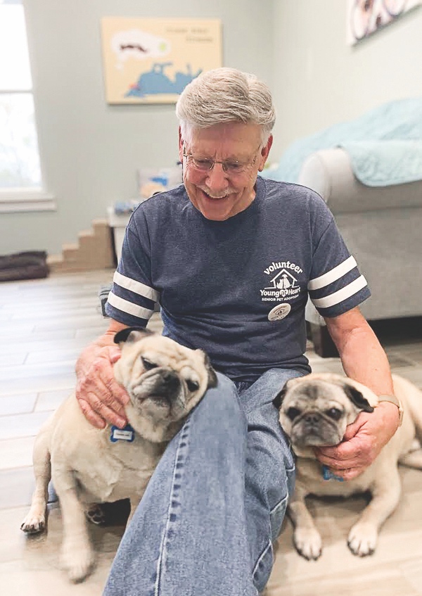 Sun City resident Allen Podraza spends much of his retirement as a volunteer at Woodstock’s Young at Heart pet adoption center, where he helps care for senior dogs and cats. (Photos provided)