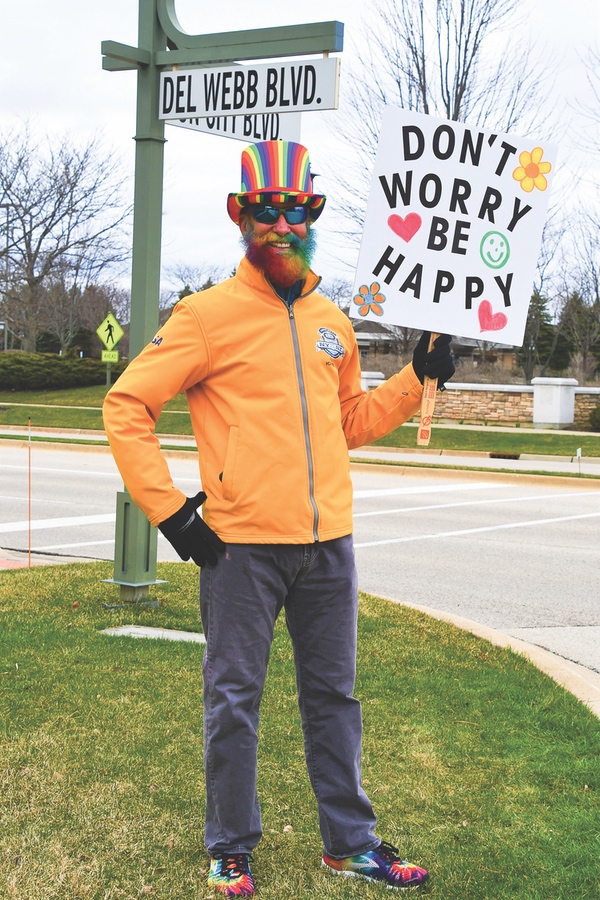 Donning a rainbow top hat and beard, Sun City resident Todd Kane tries to lift residents’ spirits amidst pandemic. (Photo provided)