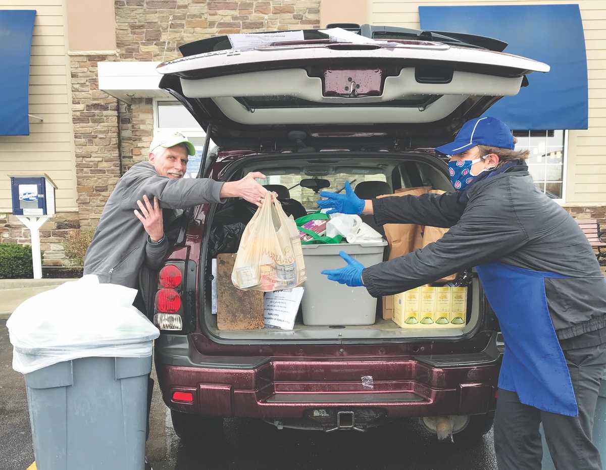 Practicing social distancing measures, Sun City residents deliver donations to Culver’s in Huntley. (Photo provided)