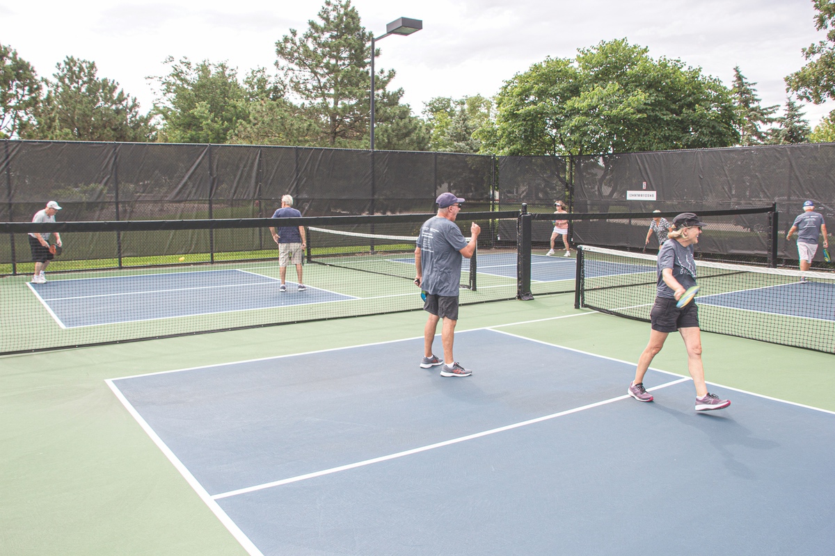 While some Sun City amenities are open with restrictions in place, such as the tennis courts and pools, others like club gatherings remain closed due, in part, according to Board President Dennis O’Leary, to liability. Overall, O’Leary says, the community has been supportive of the reopening phases within Sun City. In the photo above, residents play non-league tennis at their own discretion, as organized play is still on hold. (Photo by Tony Pratt/Sun Day)