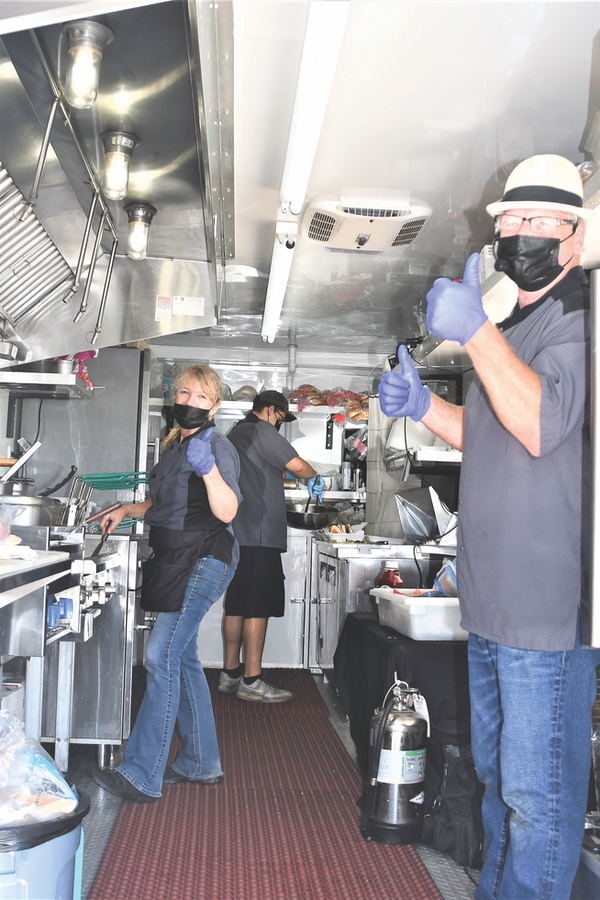 Perk-N-Pickle staff donning their PPE as they prepare food for SC residents.