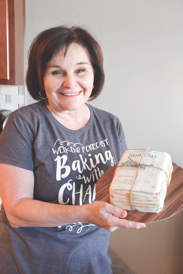 As a surprise to Sun Day reporter Christine Such, Geary baked a “Sun Day” cake featuring a recent story of Christine’s. (Photo by Christine Such/Sun Day)