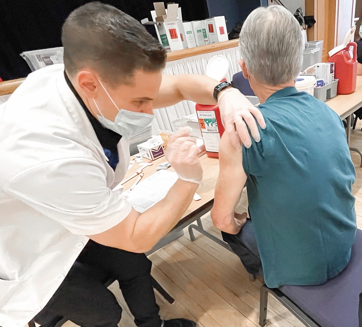 Sun City resident Michael Pribich receives his first dose of the COVID vaccine in Drendel Ballroom. (Photos provided)