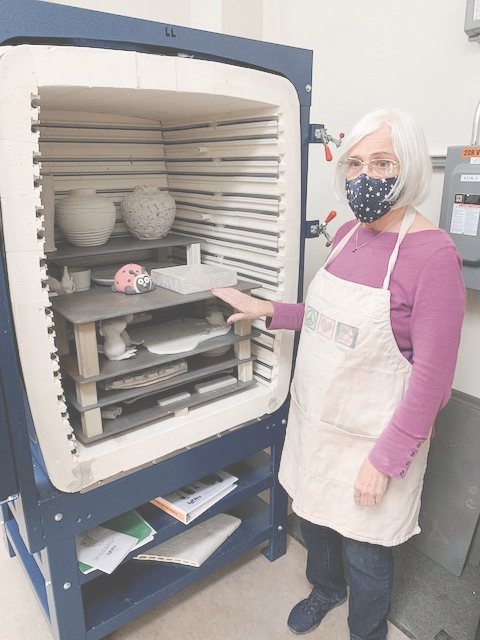 Pat England, Clayground Charter Club President, shows the inside of one of the new 2,350 degree Fahrenheit L&L Kilns in the recently renovated Clayground and Ceramics Studio. s(Photo by David Goode/Sun Day