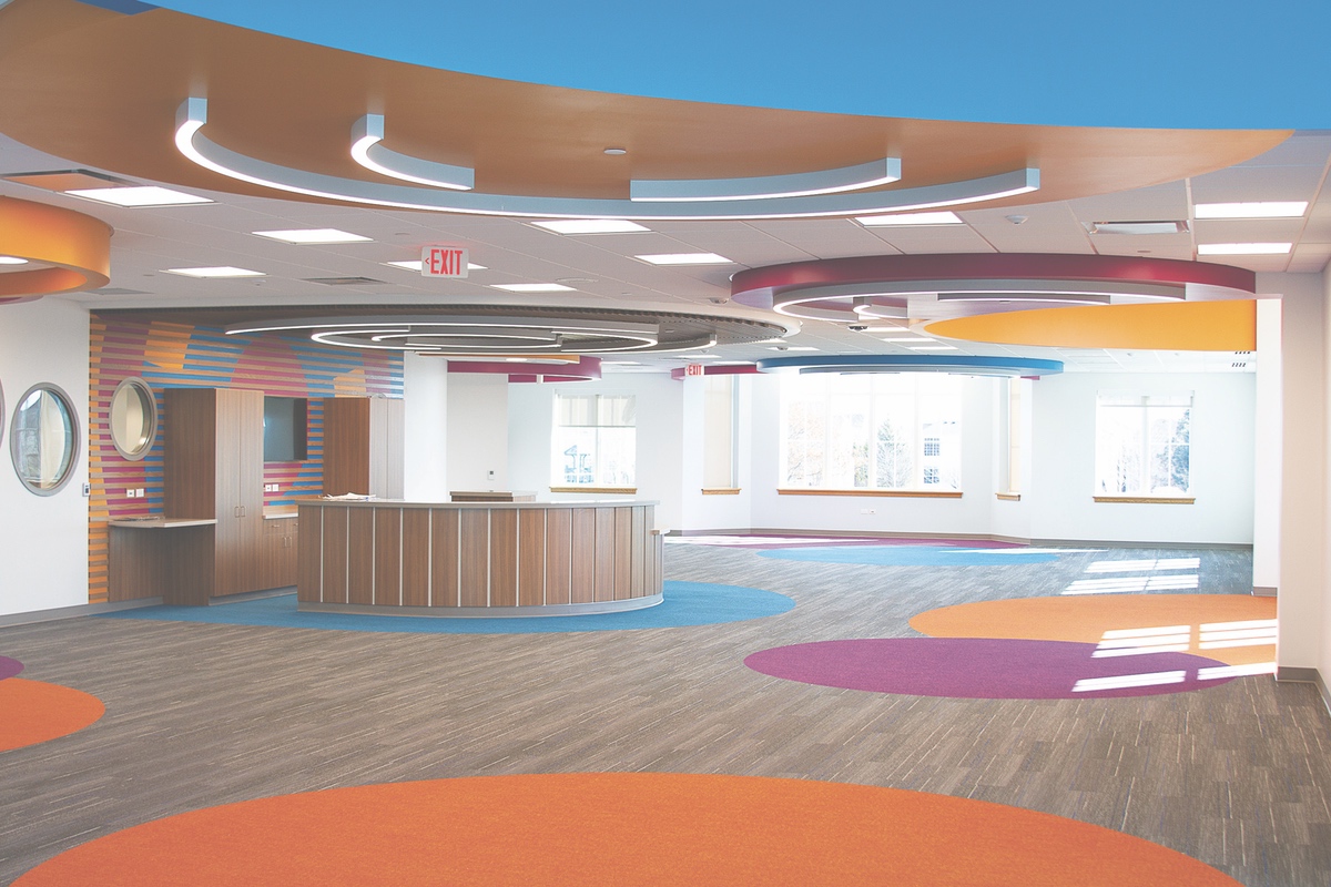Continuing with the circular theme, the children’s room features a colorful motif. It will be filled with low shelving, making media in reach of the library’s kid patrons. With its curved walls, circular themes, and colorful interior, the children’s room will be a showpiece of the new library.
