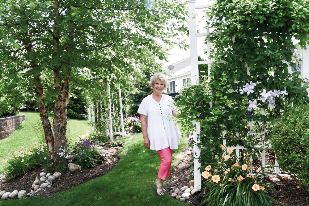 Darlene Rutledge in her garden. (Photo by Christine Such/Sun Day)