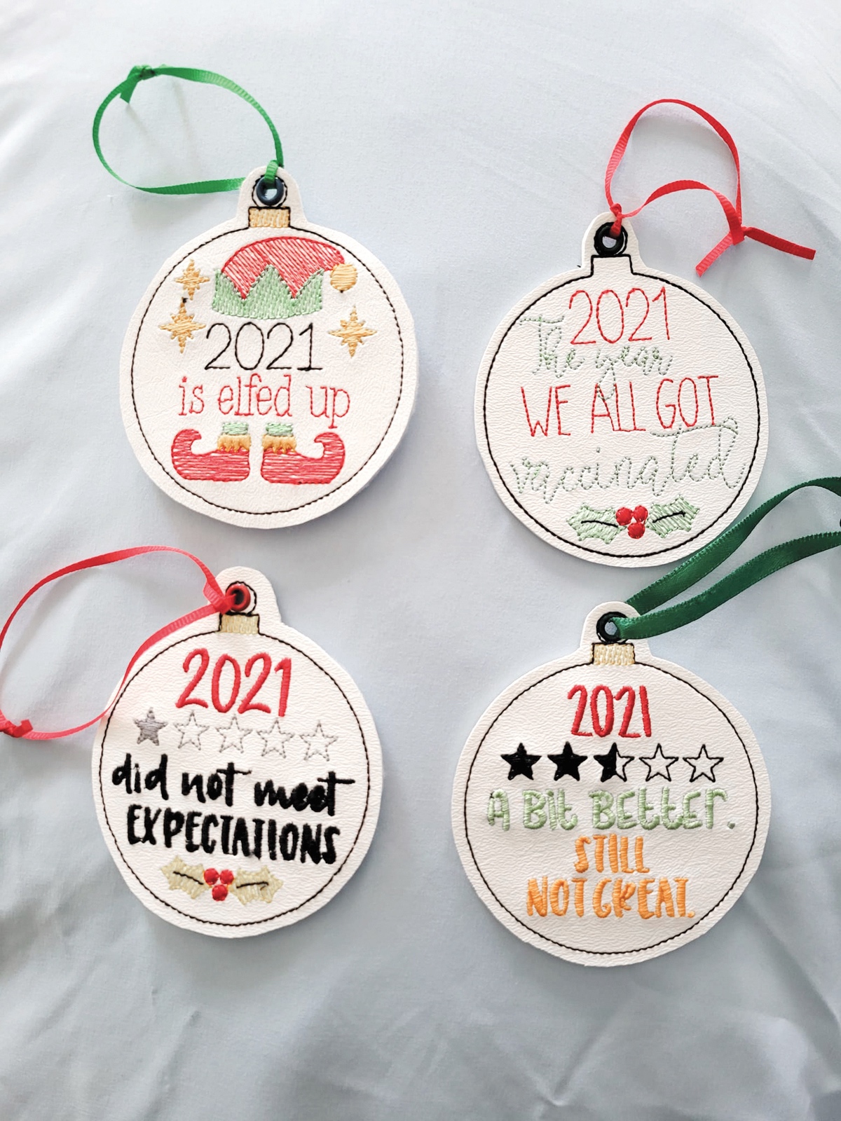 Bringing humor to the dreariness of the pandemic, Bell stitched these funny 2021 holiday ornaments.