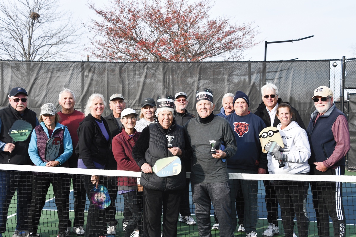The King and Queen of Pickleball Ted Reffett and Bev Perkins with their “subjects,” ie: pickleball members. (Photo by Christine Such/My Sun Day News)