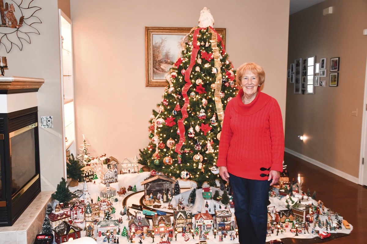 Since a little girl, Jackie Pokorny has loved miniature Christmas villages. Today she produces an elaborate display under the Christmas tree in her home. (Photo by Christine Such/My Sun Day News)