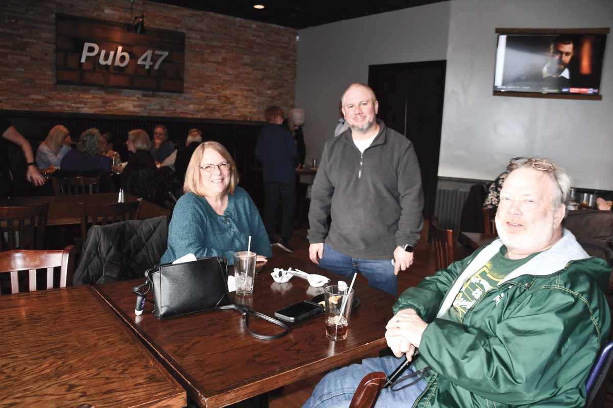 Kathy and Kurt Wendhack (seated) with Managing Partner Sean Hand. (Photo by Christine Such/My Sun Day News)