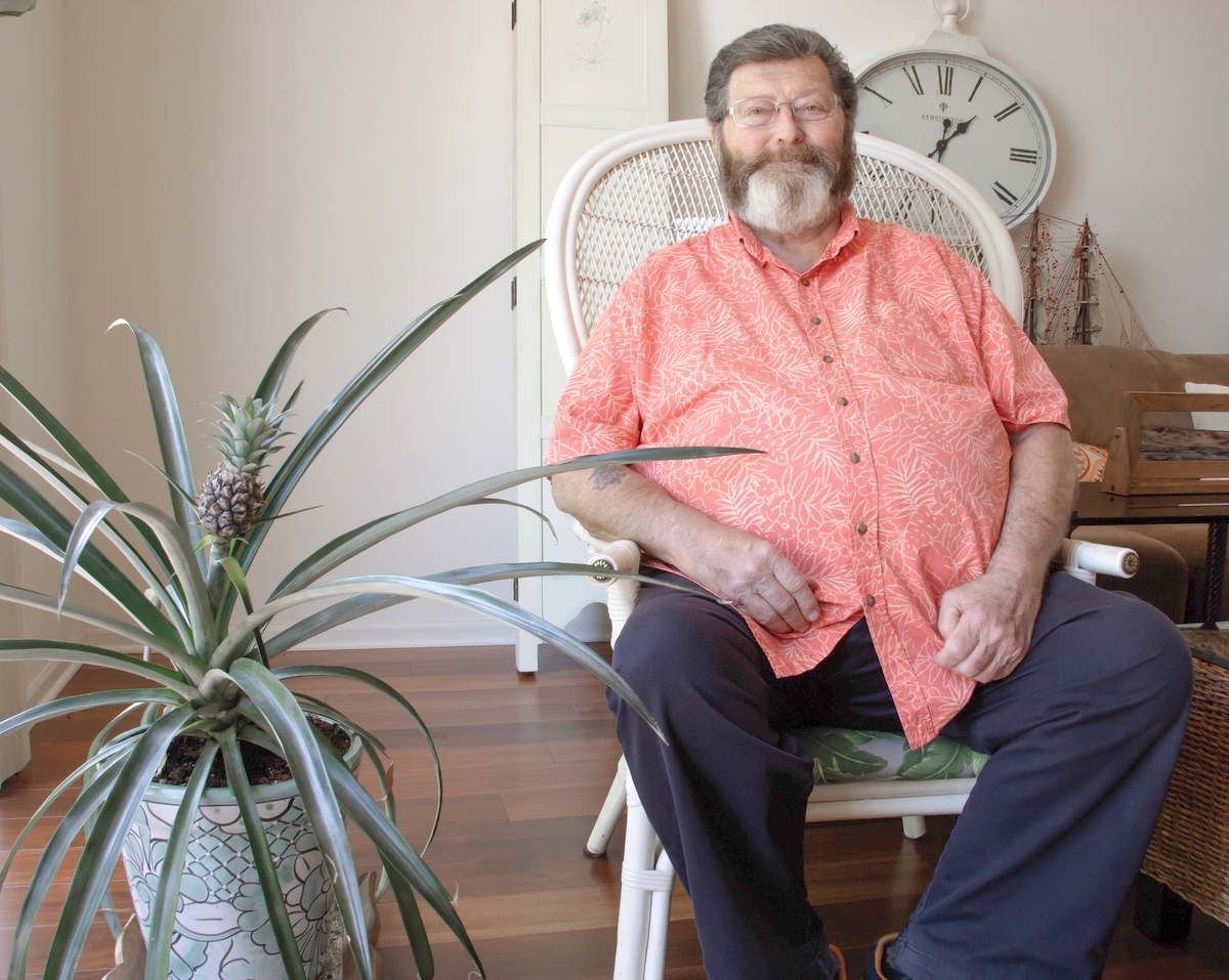 Using the ethylene that off-gasses from apples, Sun City resident Bob Begora, a former wholesale produce buyer for major hotel chains, grew a pineapple in his home. (Photos by Tony Pratt/My Sun Day News)