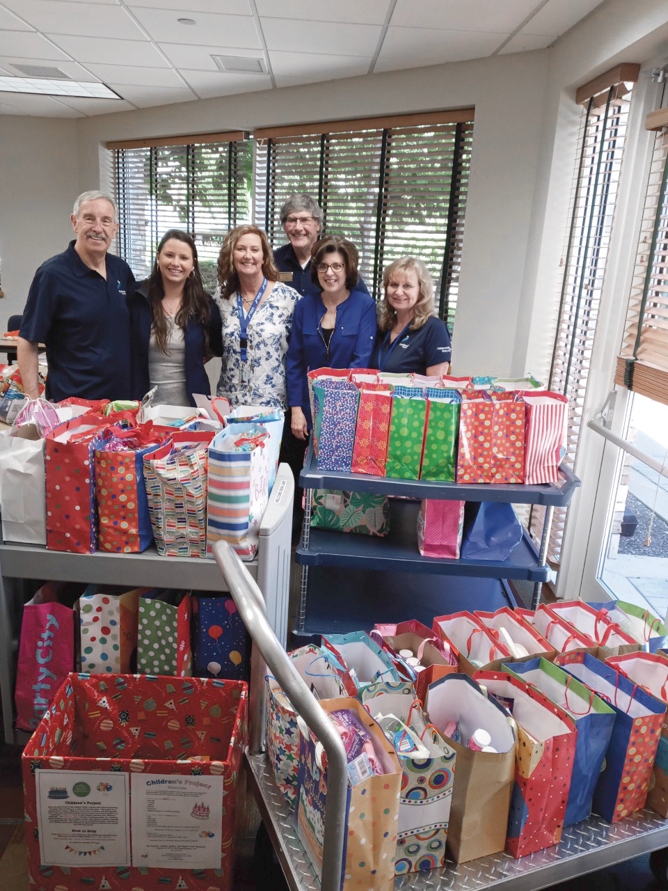 (L to R) Michael McLaughlin, Ally Nebel, Kathy O’Toole, Bob Laird, Debby Seger, Jennifer Klages prepare birthday bags. (Photo provided)