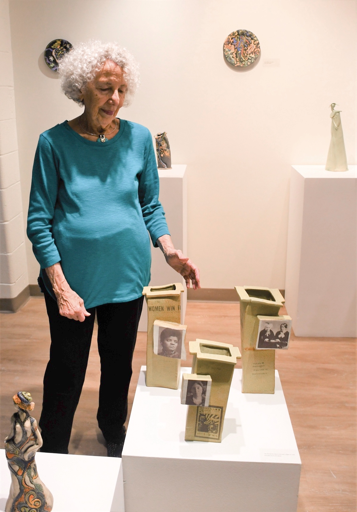 Elaine Kadakia with her pieces depicting women who have fought for women’s rights. (Photo by Christine Such/My Sun Day News)