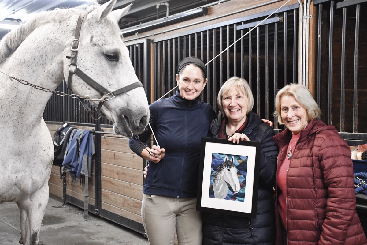 (L to R) Cricket, Elizabeth Graffron, artist Karen Semancik, and Pat Cox. Semancik displays her textile rendition of Cricket, commissioned by Pat Cox for Graffron. (Photo by Christine Such/My Sun Day News)