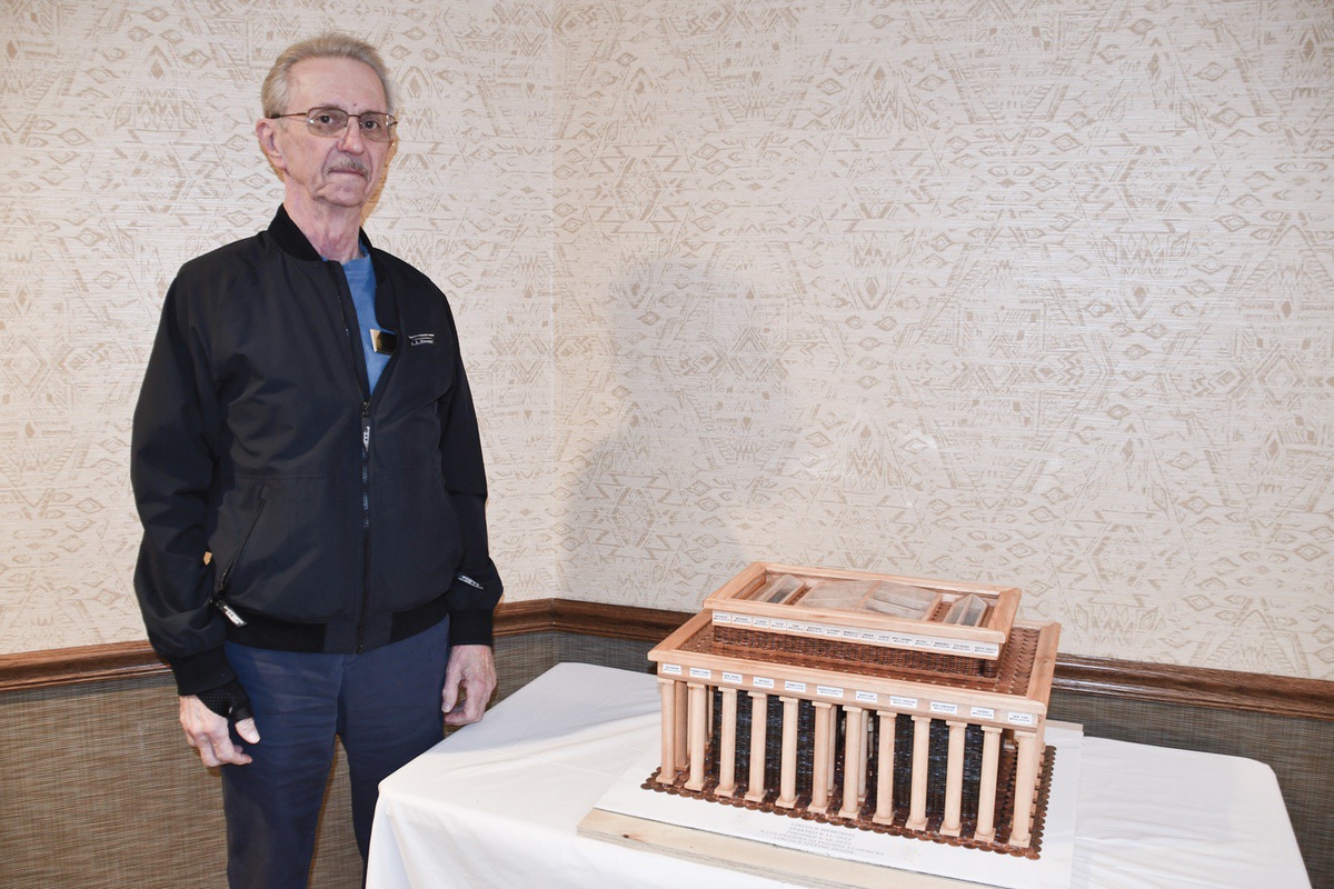 Russ Becker poses with his replica of the Lincoln Memorial he built with pennies. (Photo by Christine Such/My Sun Day News)