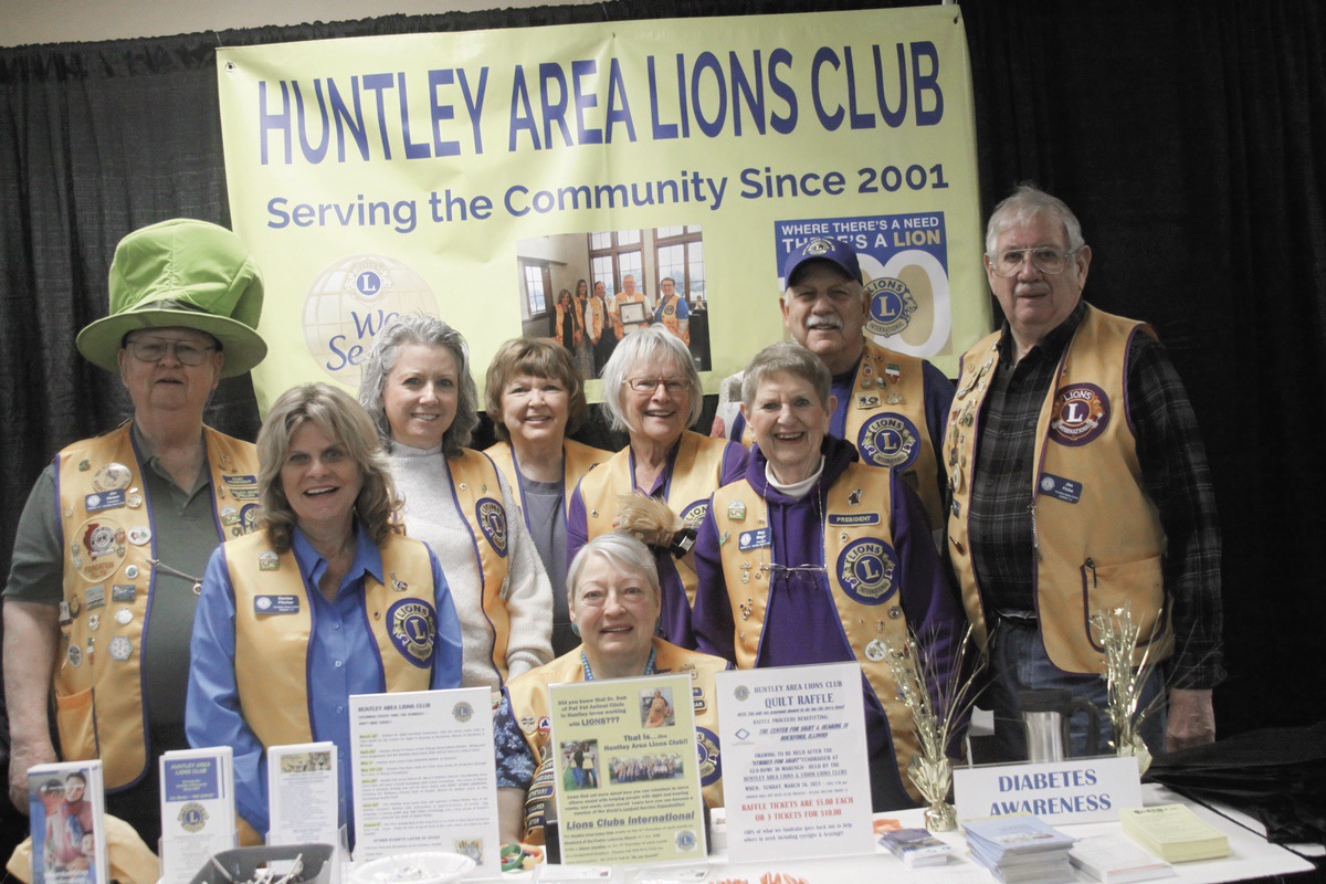 Huntley Area Lions Club members gather at the Huntley Area Chamber of Commerce's Home, Business and Wellness Expo March 18 at Huntley Park District. First row from left: Jim Harper, Kari Freeman, Pam Palmer, Sandra Schuessler, Jim Saletta and Jim Ficke. (Photo by Steve Peterson/My Sun Day News)