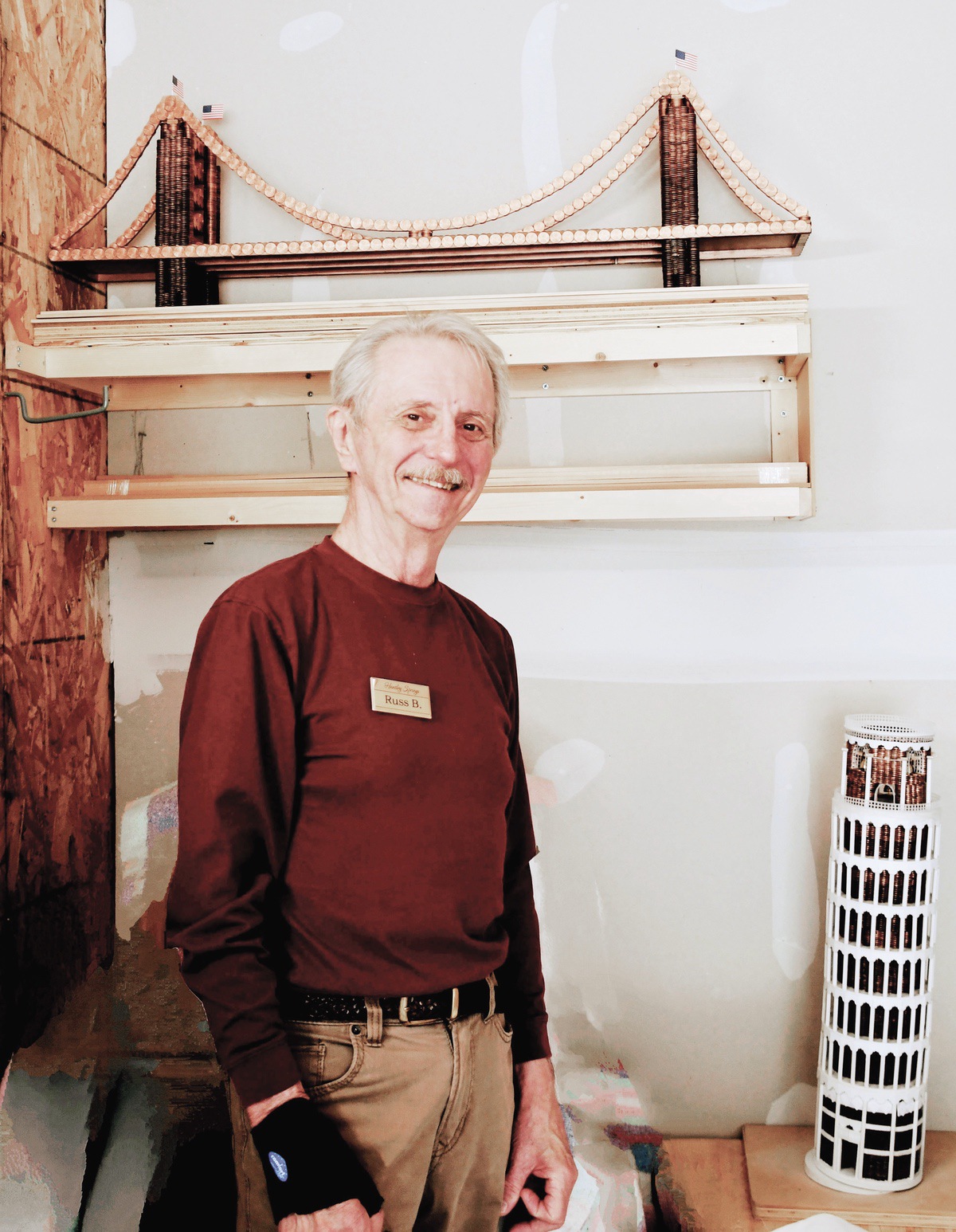 Russ Becker with his Tower of Pisa and The Golden Gate Bridge. (Photo by Christine Such/My Sun Day News)