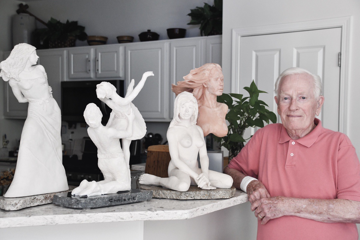 Richard Christie featured here with some of his favorite sculptures. (Photo by Christine Such/My Sun Day News)