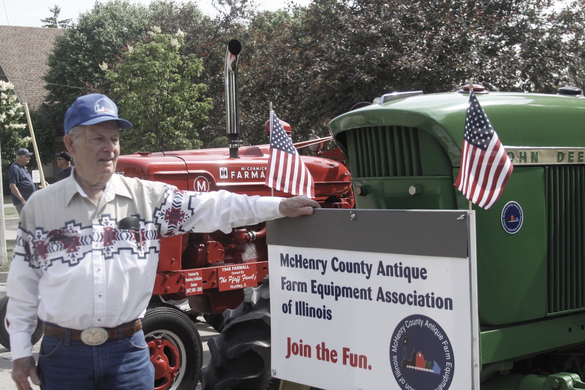 Jim Jones of the McHenry County Antique Farm Equipment Association, with a 1970 John Deere tractor. (Photo by Steve Peterson/My Huntley News)