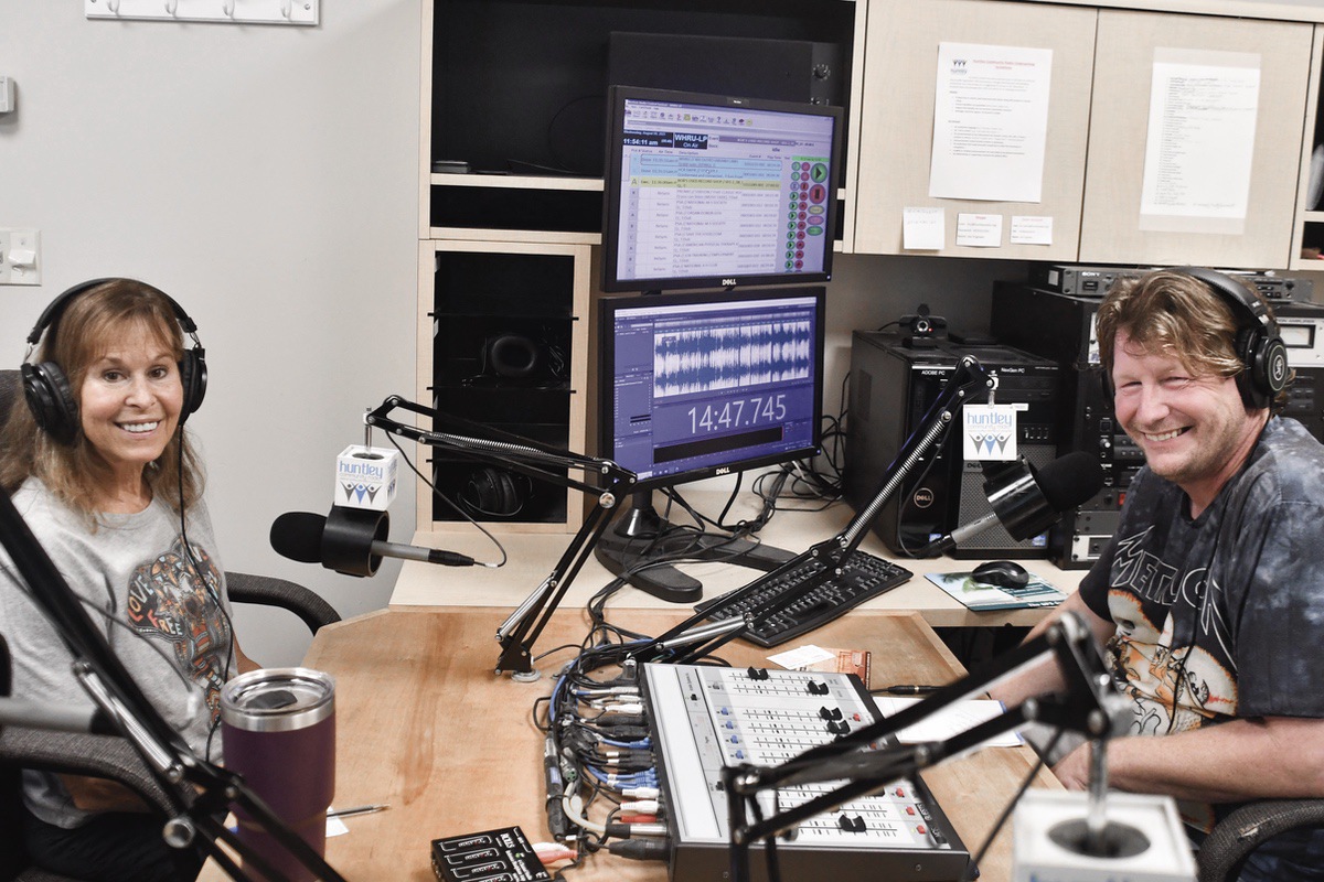 Certified yoga instructor Debbie Smith talks about Dog Yoga with Mike Caserno’s on Huntley Community Radio show Breathe ‘N Bounce — 101.5 FM on your radio. (Photo by Christine Such/My Sun Day News)