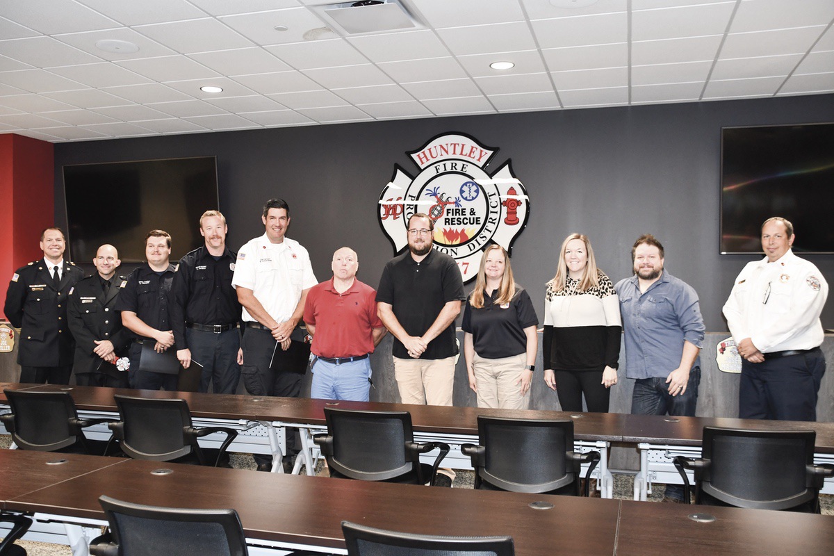 It took a team to save Robert McIntyre’s (center, red shirt) life, using effective CPR efforts, both bystander given and advanced. (Photo by Christine Such/My Sun Day News)