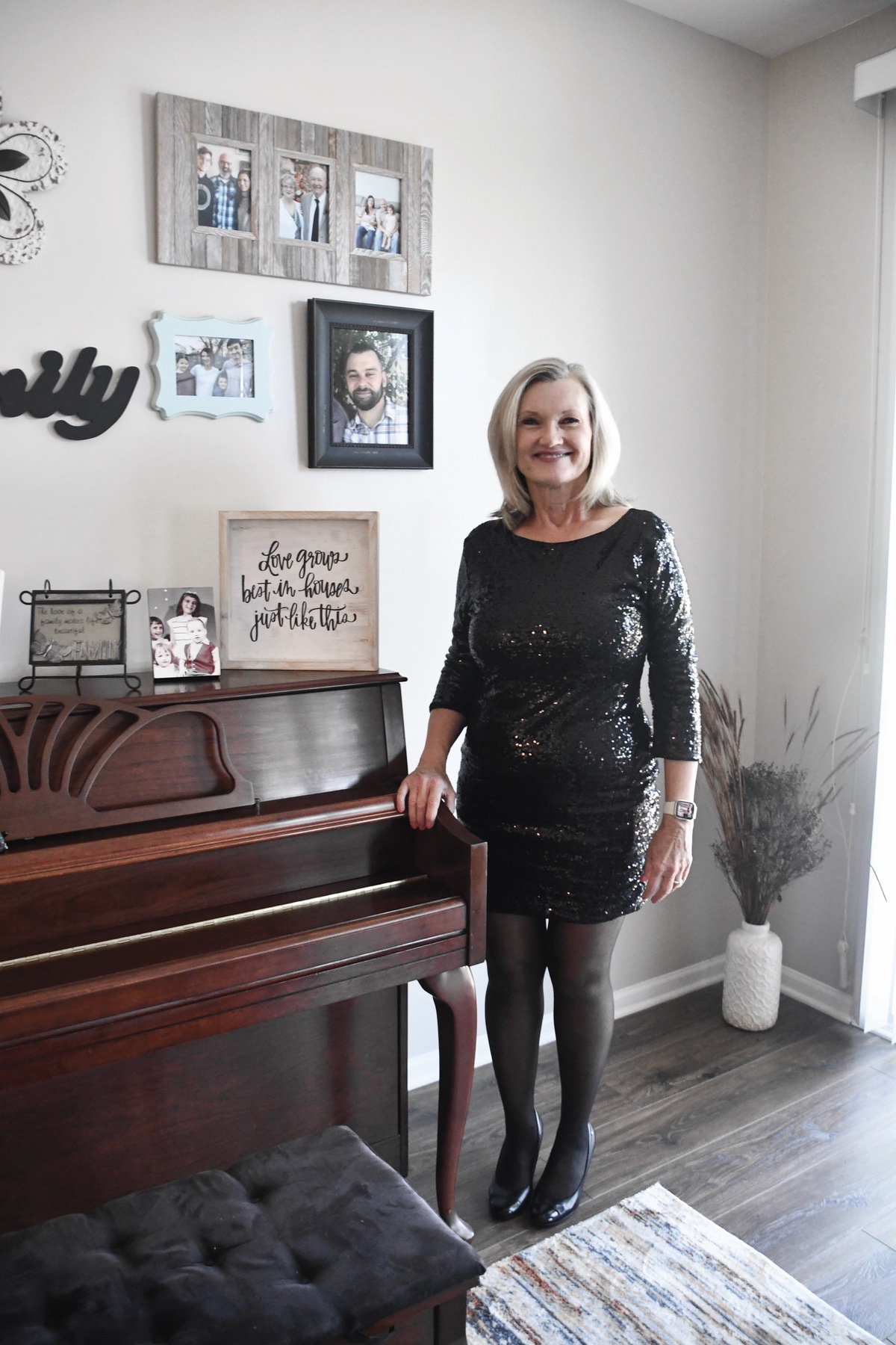 Terri Pearl stands by the instrument that started her musical passion. (Photo by Christine Such/My Sun Day News)