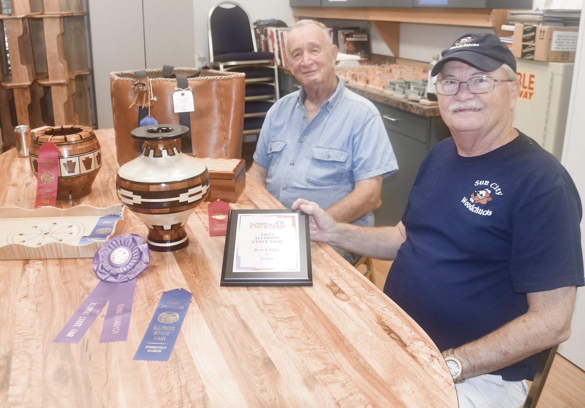 (L to R) Woodchucks Rich Escallier and Ed Cuttle with winning pieces from the 2023 Illinois State Fair. (Photo by Christine Such/My Sun Day News)
