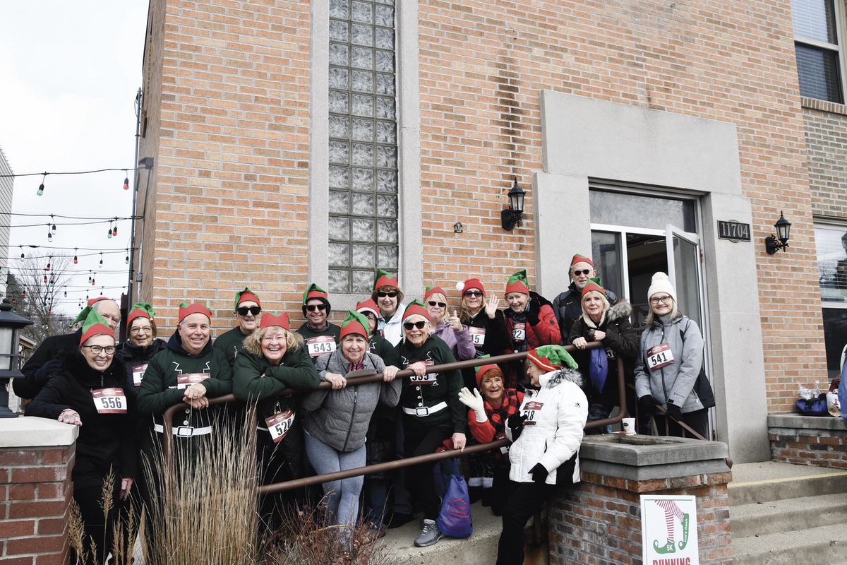 Tall Oaks Tennis Club members don elf hats for and participate in community event at Very Merry Huntley. (Photo by Christine Such/My Sun Day News)