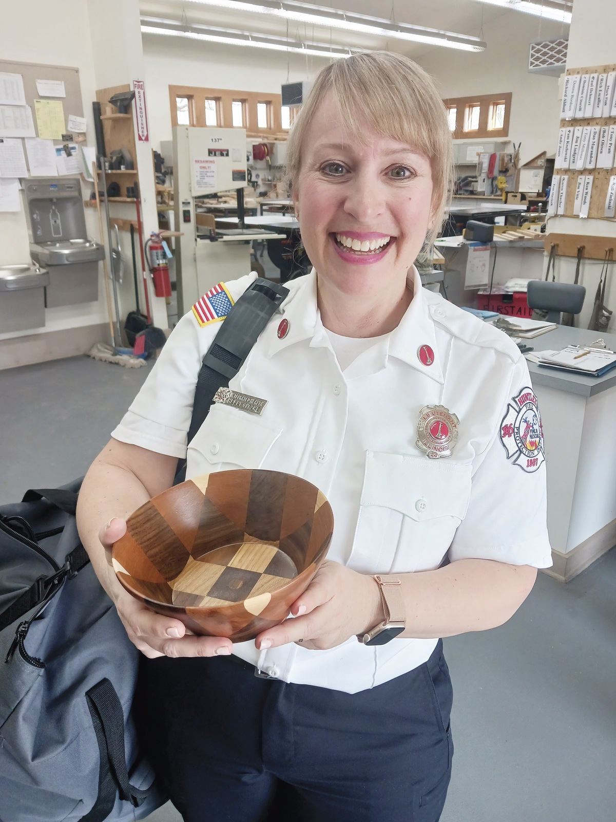 Lt. Kelly Gitzke receives a Woodchuck thank you for her presentation to the club. (Photo by Christine Such/My Sun Day News)