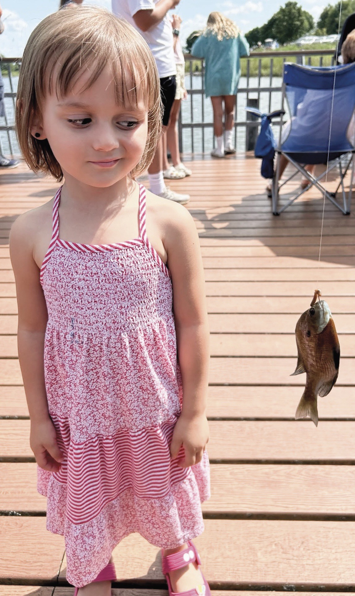 Charlotte Hartl, 4, measures up her big catch!