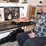 Sun City resident Bob Hartman has authored several books on the history of the famous and distinguised Larson guitars, which were designed and crafted by Hartman’s grandfather, Carl Larson. (Photo by Christine Such/My Sun Day News)