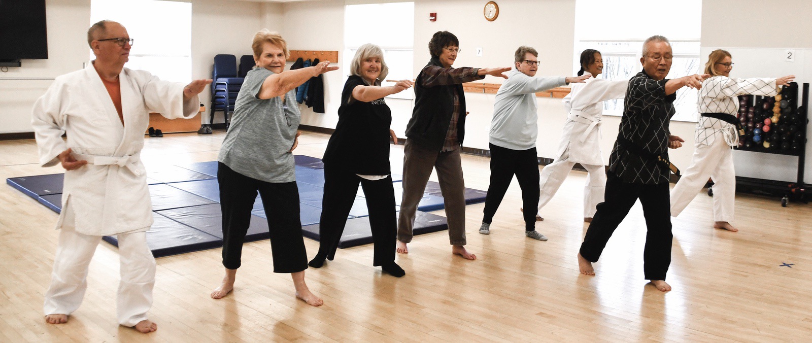 Grandmaster Gedo Chang (black gi) leads the Hapkido class, with daughter Laura Paarmann on the far right. (Photo by Christine Such/My Sun Day News)