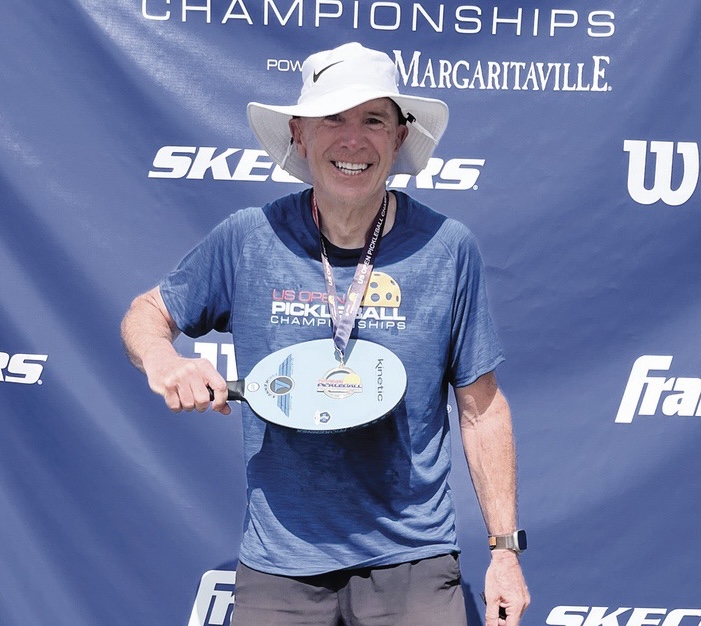 John Schwan proudly shows his US Open Pickleball Championship gold medal. (Photo provided)