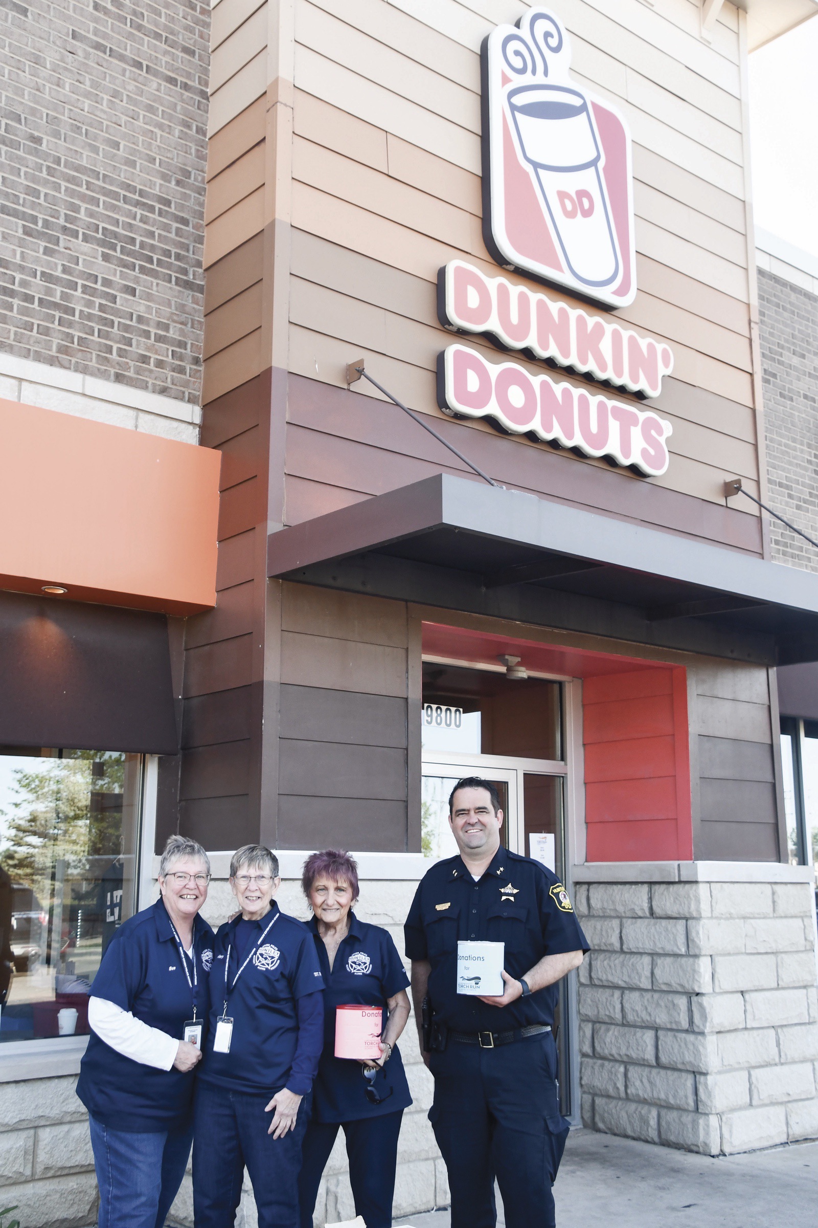 L to R: Sue Wallace, Mary Schlee, Maria Chakos, and Deputy Chief Kevin Keane raising funds for Special Olympics. (Photo by Christine Such/My Sun Day News)