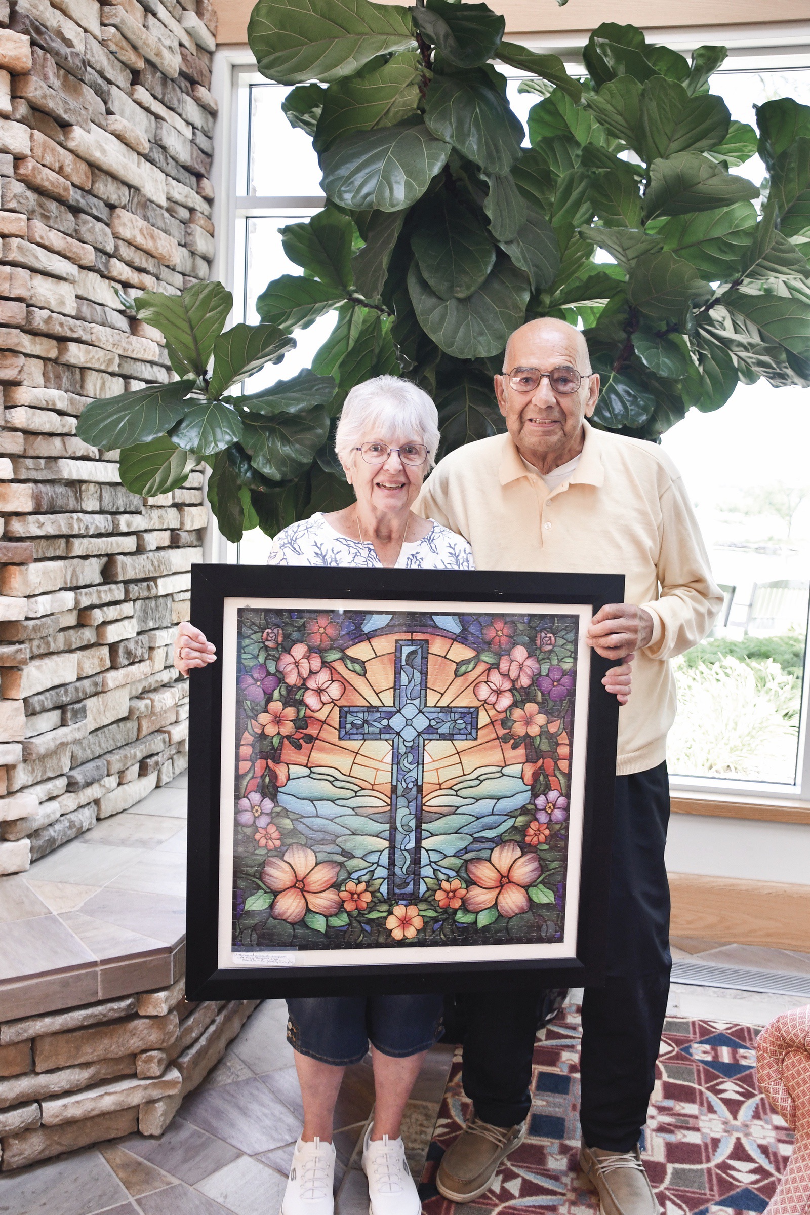 It took master puzzler Joseph Ortega five weeks to complete the puzzle shown here, which he framed and gifted to JoAnn Ginoza as an act of appreciation for her kindness. (Photo by Christine Such/My Sun Day News)
