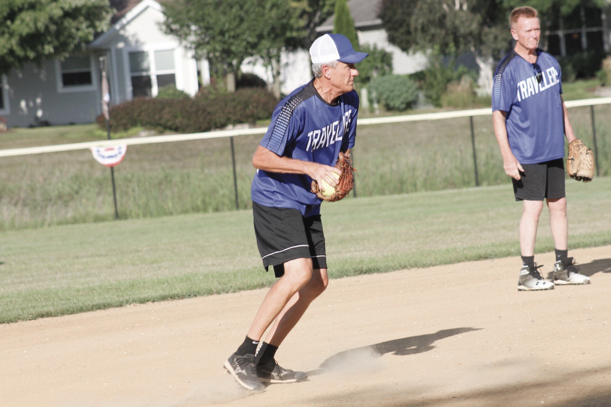 Action continued to be fastpaced at the Sun City Softball Club’s post-season tournament at Veterans Memorial Field. Paul Thompson of the Travelers fields a ground ball against the Coyotes. The Travelers kept their season going with a 9-6 win over the Coyotes in a losers bracket game Aug. 22. A highlight of this week’s games was the Hurricanes’ 1-0 win over topseed Lumberjacks. (Photo by Steve Peterson/My Sun Day News)