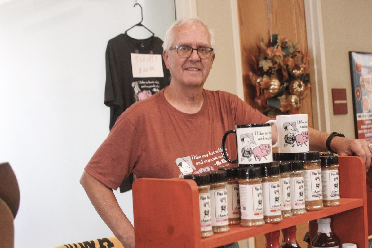 Visitors to the Sun City Fall Consumer Showcase could sample several products of Steve Valenta, aka “The Sauce Boss” of Papa Valachy. He offers bbq sauces, seasonings, rubs, and coatings. (Photo by Steve Peterson/My Sun Day News)