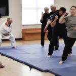 Hapkido Master Laura Paarmann (far left) leads Sun City residents in the powerful art of Hapkido to keep active, improve physical movement, and maintain overall wellness. (Photo by Christine Such/My Sun Day News)
