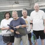 A Tall Oaks Tennis Charter Club group takes a break while playing tennis at a The Racquet Club outing in Crystal Lake. From left: Jeanne Bartels, Nancy Fontana, Mike Plaminek and Tim Johnson. (Photo by Steve Peterson/My Sun Day News)