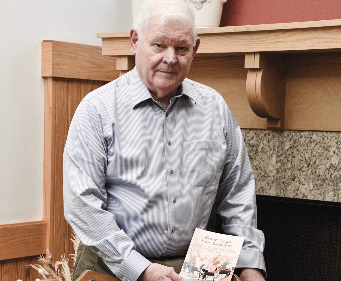 It’s Steve Ferry’s intent with his new book to keep seniors active and continue aging with energy, so take a seat and read and do some yoga, as his book suggests. (Photo by Christine Such/My Sun Day News)