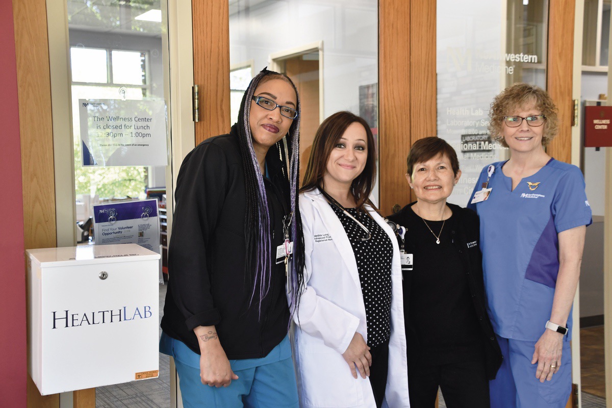 From wellness checks to educational programs, the Northwestern Wellness Center Staff brings years of experience to their myriad services. (L to R) Phlebotomist Gennesia Crowley, Nurse Practitioner Matilda Lutaj, Patient Services Representative Elena Makris, and RN Lori Marcantonio comprise the NW Wellness Center team. (Photo by Christine Such/My Sun Day News)