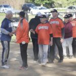 The Adjusters and Coyotes congratulate each other after season opener. (Photo by Steve Peterson/My Huntley News)