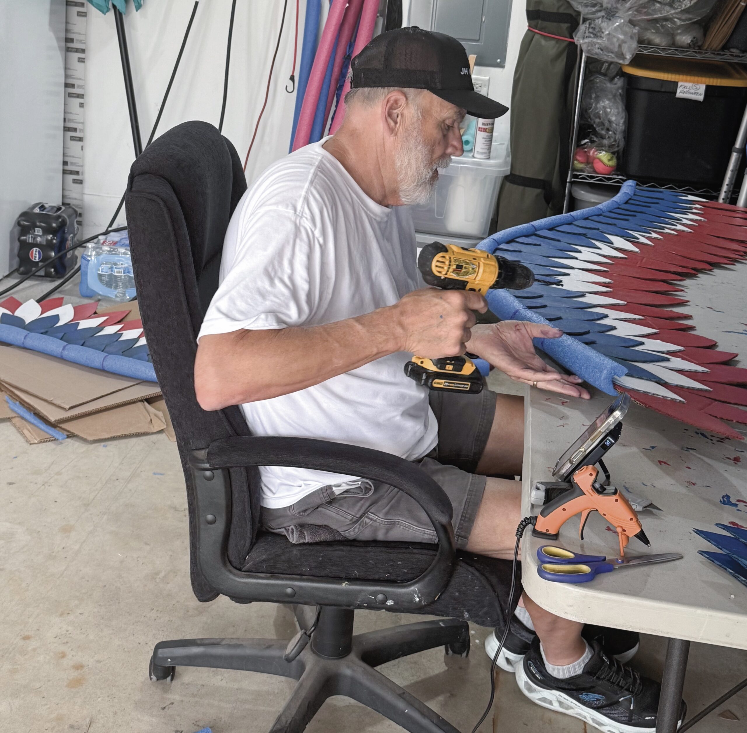 John Garland of the Birdwatching Club works on assembling the wings.
