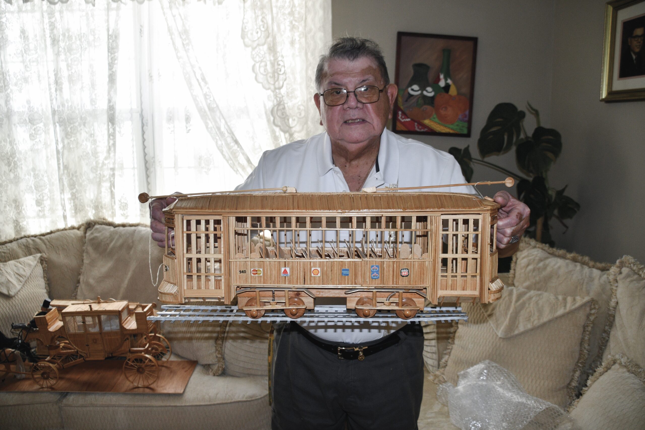 This model of a mobile home features fully functional lights and even a tiny chandelier.
